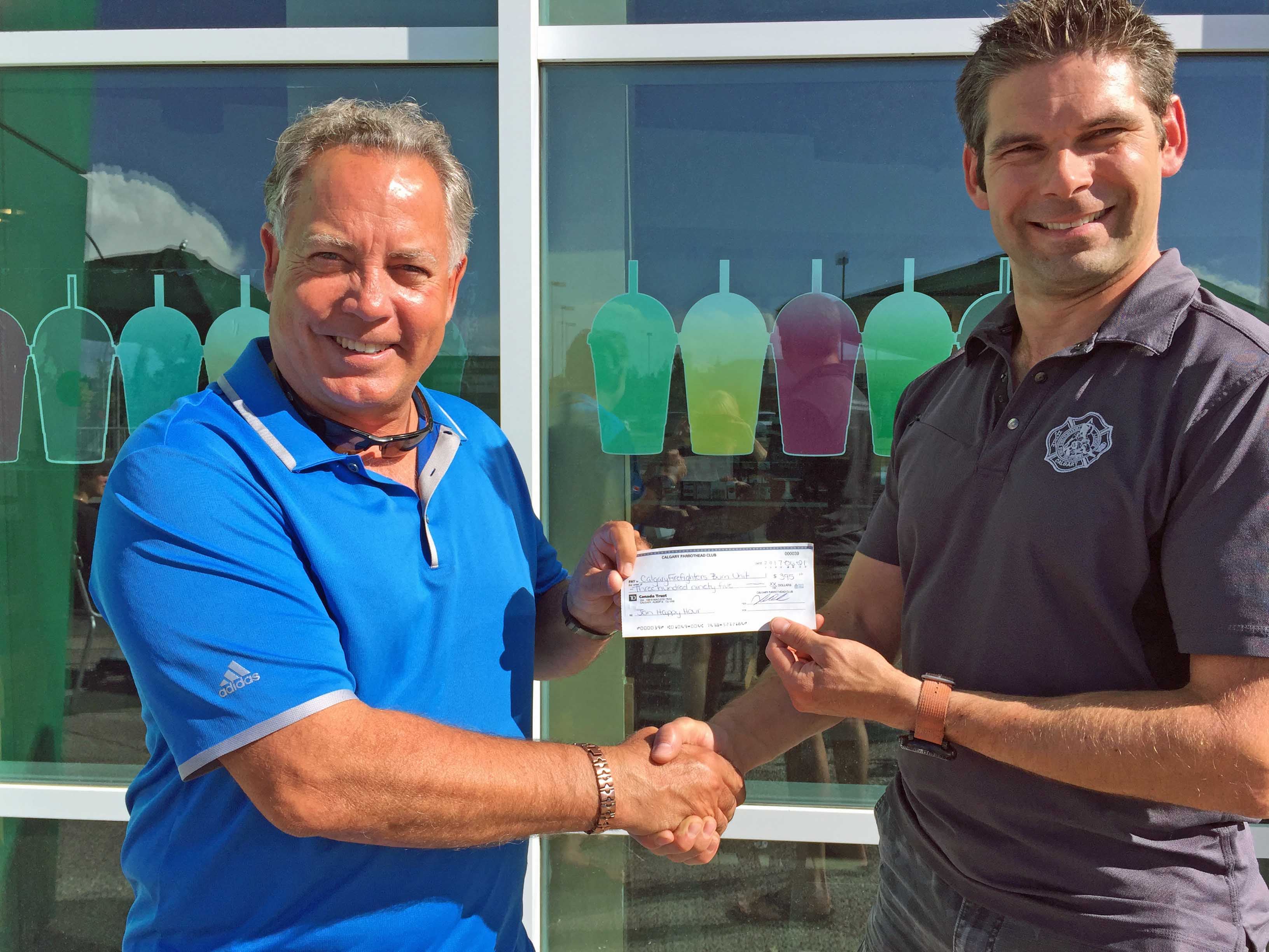 Cheque from Calgary Parrot Head Club to Fire Fighters Burn Treatment Society