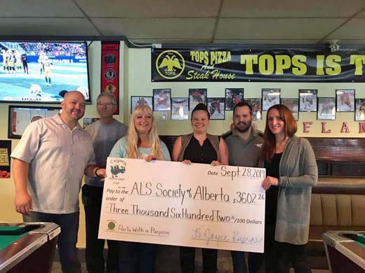 Calgary Parrot Head Cheque Presentation to ALS Socieity At Tops Pizza